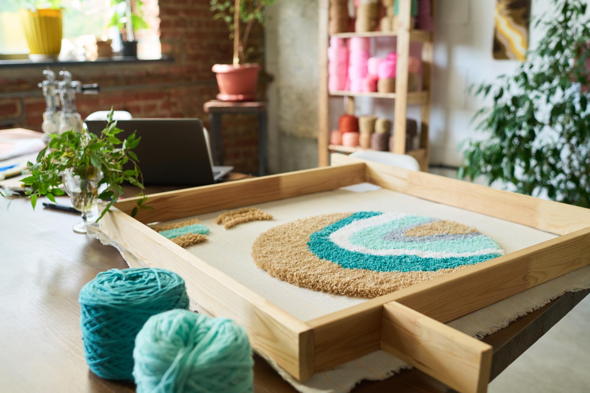 Embroidery studio corner with workbench and threads