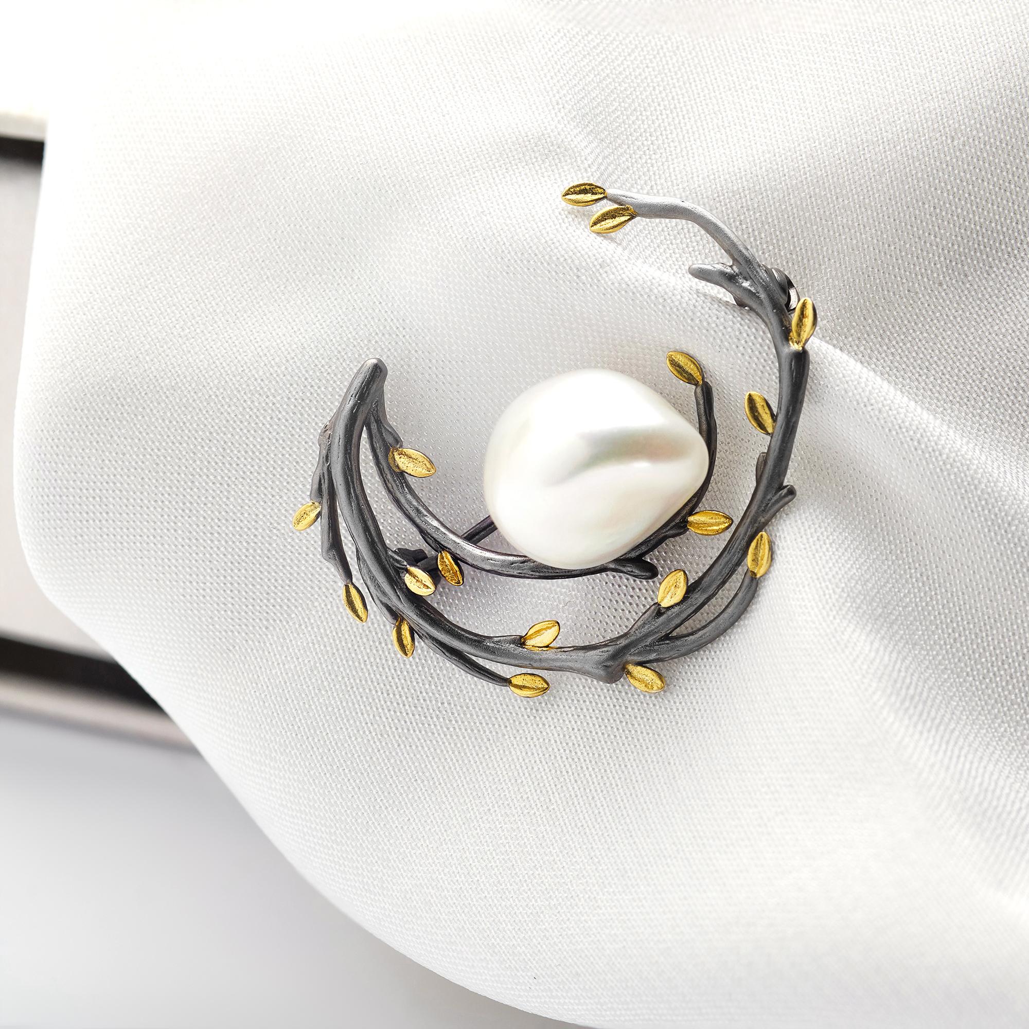 Embroidered badge with metallic thread